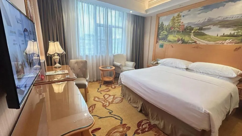 Bed in Vienna Hotel Guangxi Beiliu Passenger Station