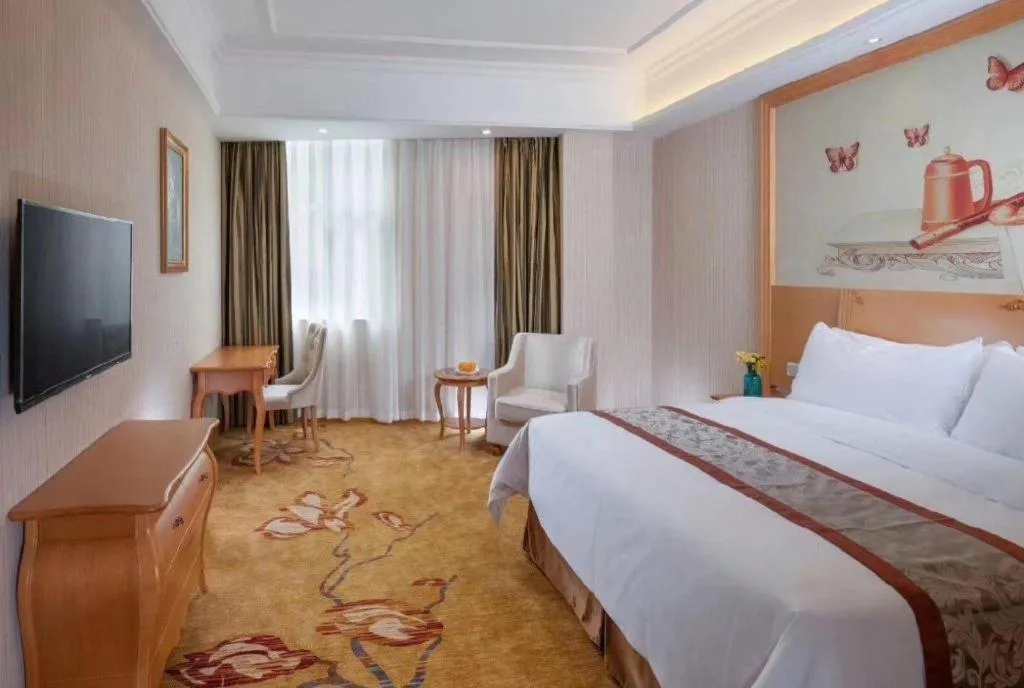 Bed in Vienna Hotel Guangxi Beiliu Passenger Station