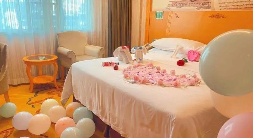 Bed in Vienna Hotel Guangxi Beiliu Passenger Station