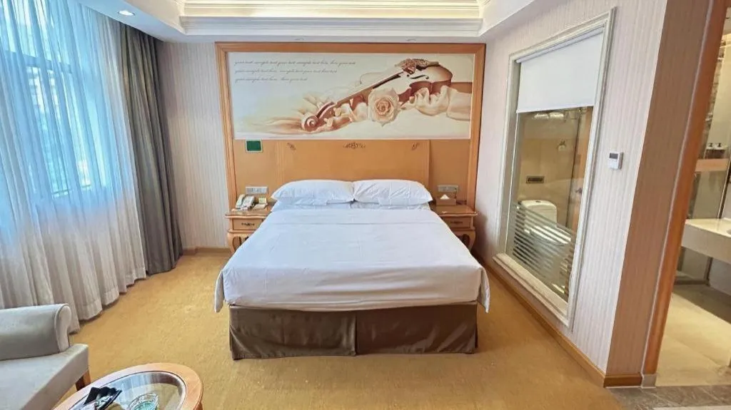 Bed in Vienna Hotel Guangxi Beiliu Passenger Station