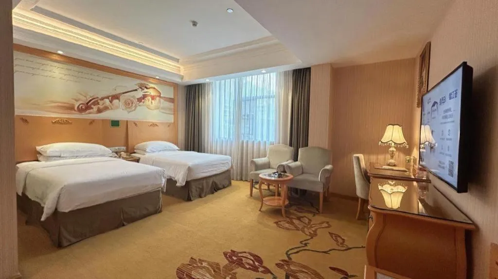 Bed in Vienna Hotel Guangxi Beiliu Passenger Station