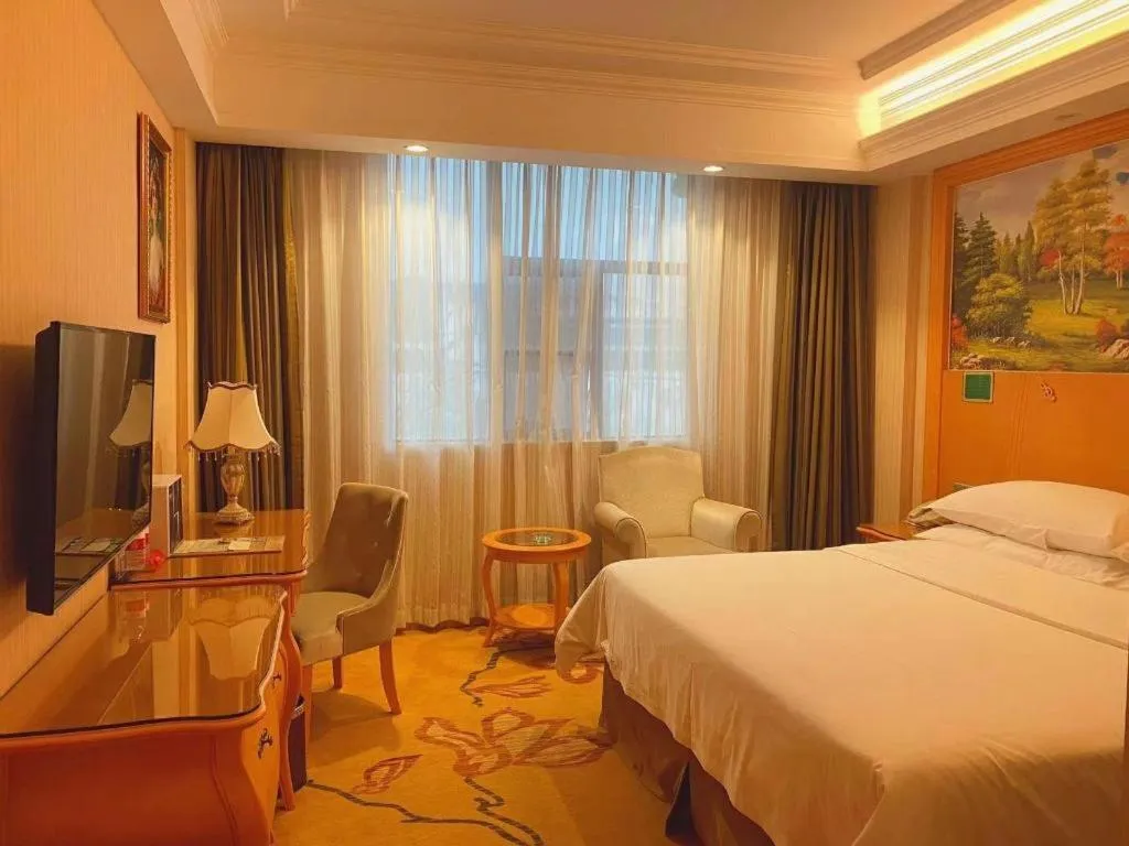 Bed in Vienna Hotel Guangxi Beiliu Passenger Station