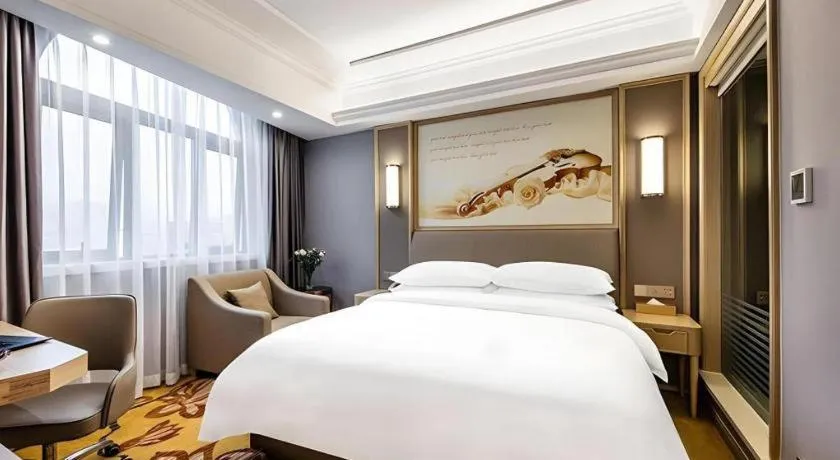 Bed in Vienna Hotel Zhejiang Lishui Qingtian Post Building