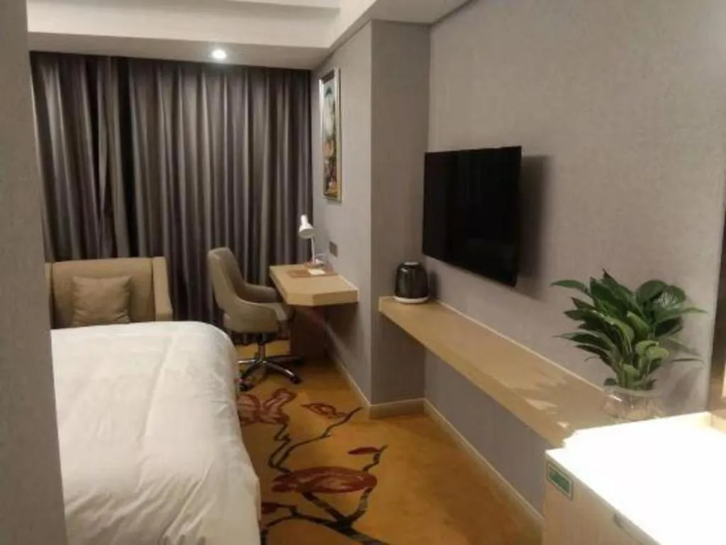 Bed in Vienna Hotel Zhejiang Lishui Qingtian Post Building