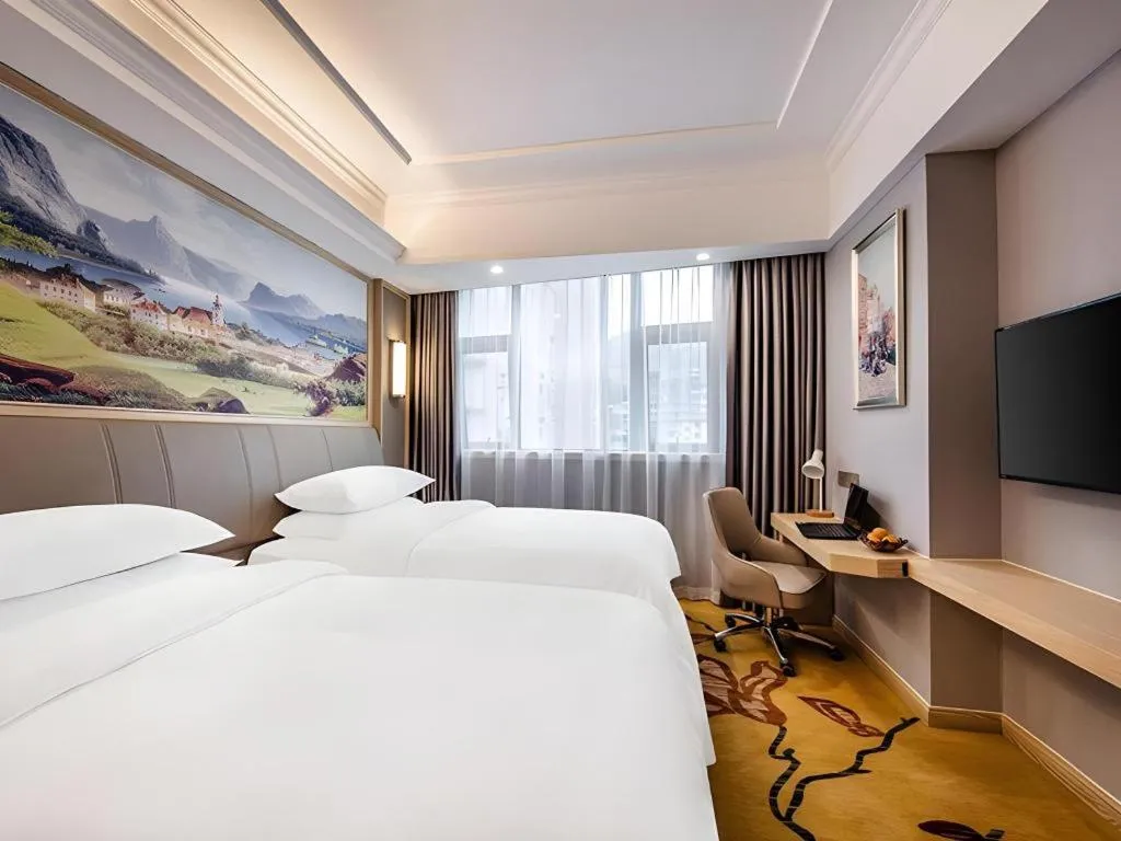 Bed in Vienna Hotel Zhejiang Lishui Qingtian Post Building