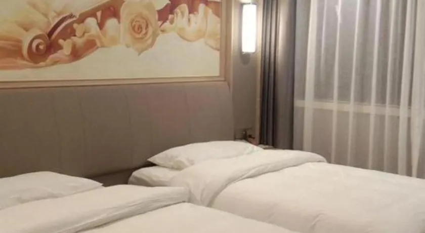 Bed in Vienna Hotel Zhejiang Lishui Qingtian Post Building