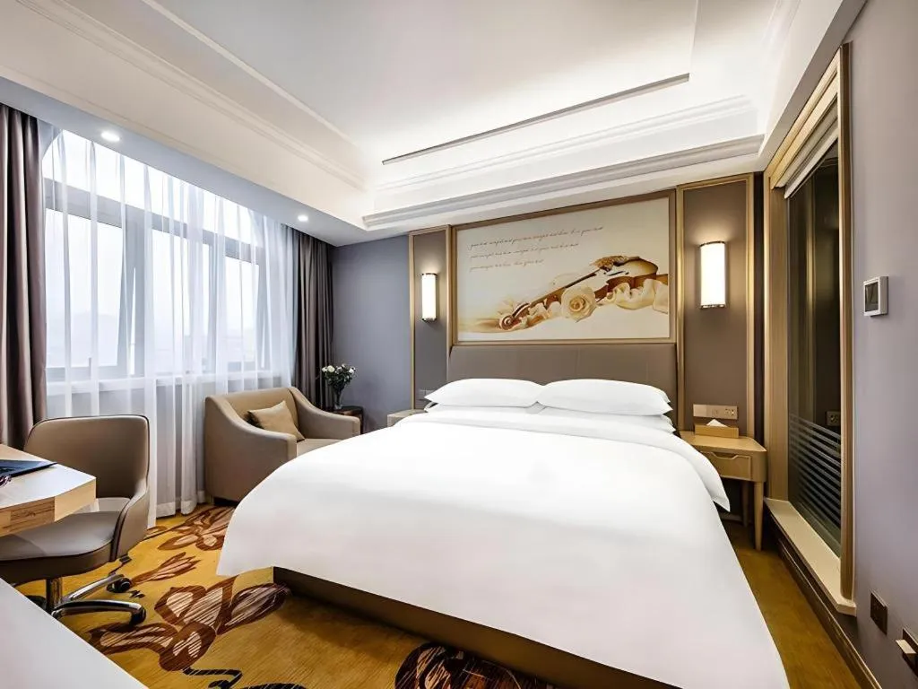 Bed in Vienna Hotel Zhejiang Lishui Qingtian Post Building