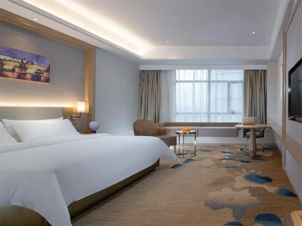 Bed in Vienna Hotel Xinfeng West High-Speed Railway Station