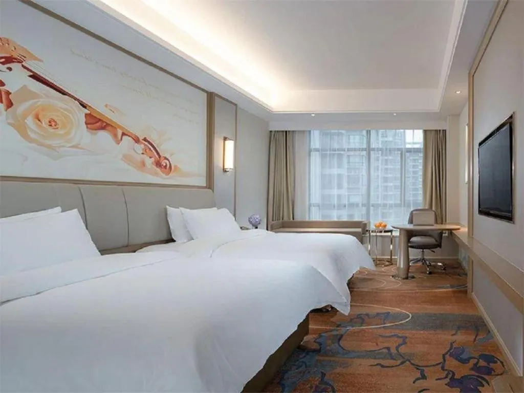 Bed in Vienna Hotel Xinfeng West High-Speed Railway Station