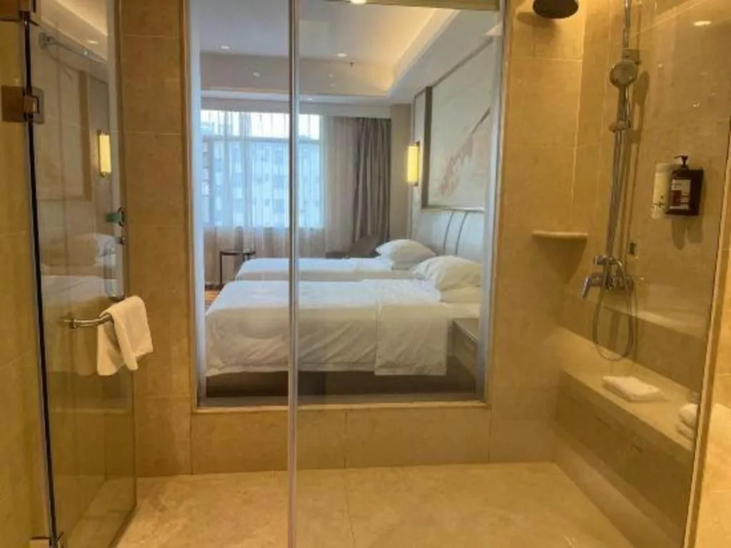 Bed in Vienna Hotel Xinfeng West High-Speed Railway Station