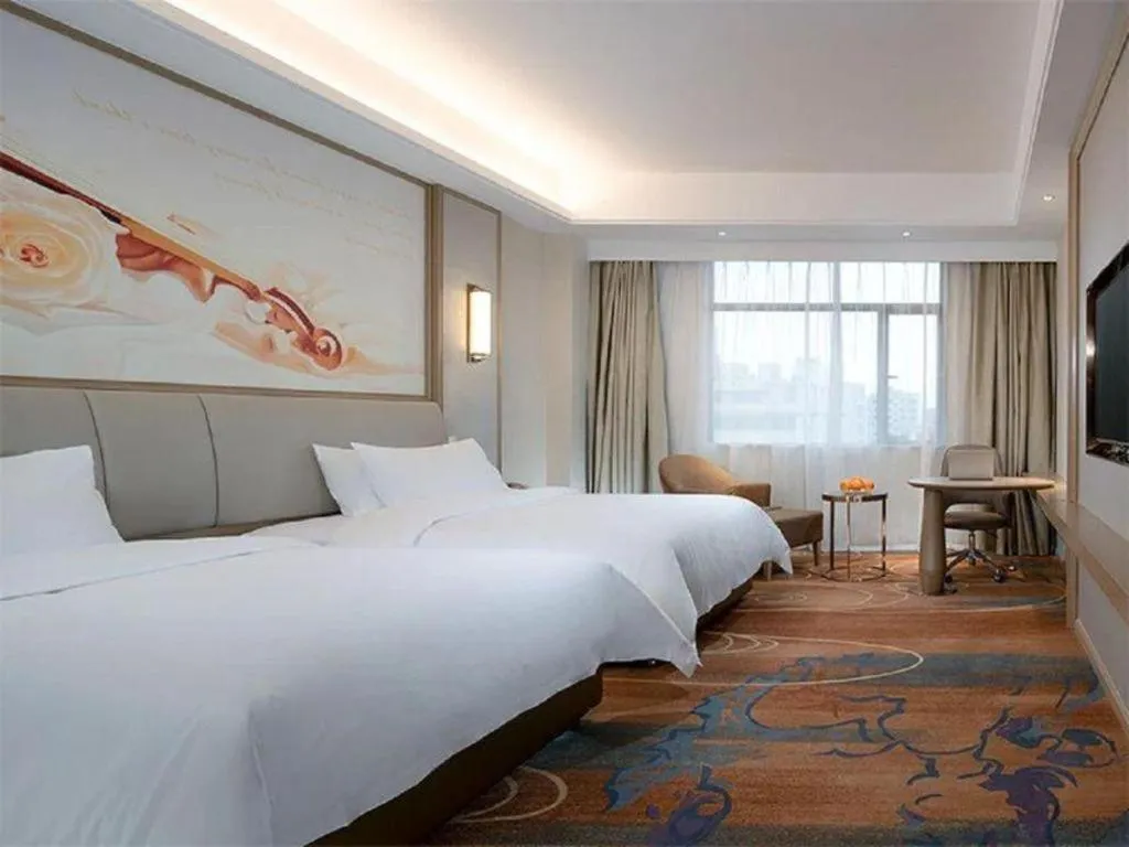 Bed in Vienna Hotel Xinfeng West High-Speed Railway Station