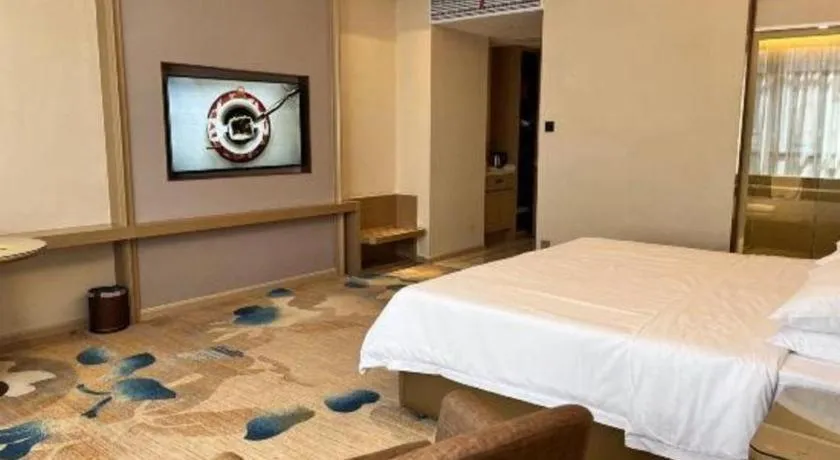 Bed in Vienna Hotel Xinfeng West High-Speed Railway Station