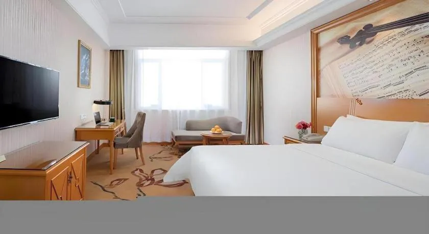 Bed in Vienna Hotel Shanxi Datong High-Speed Railway Station Wanda Plaza