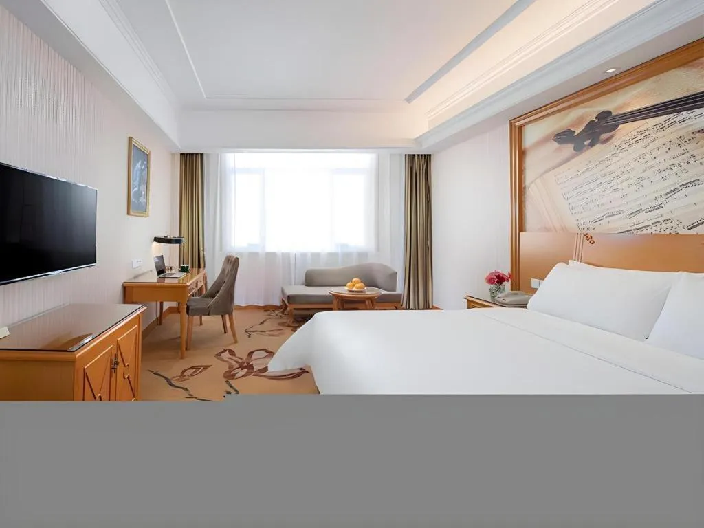 Bed in Vienna Hotel Shanxi Datong High-Speed Railway Station Wanda Plaza