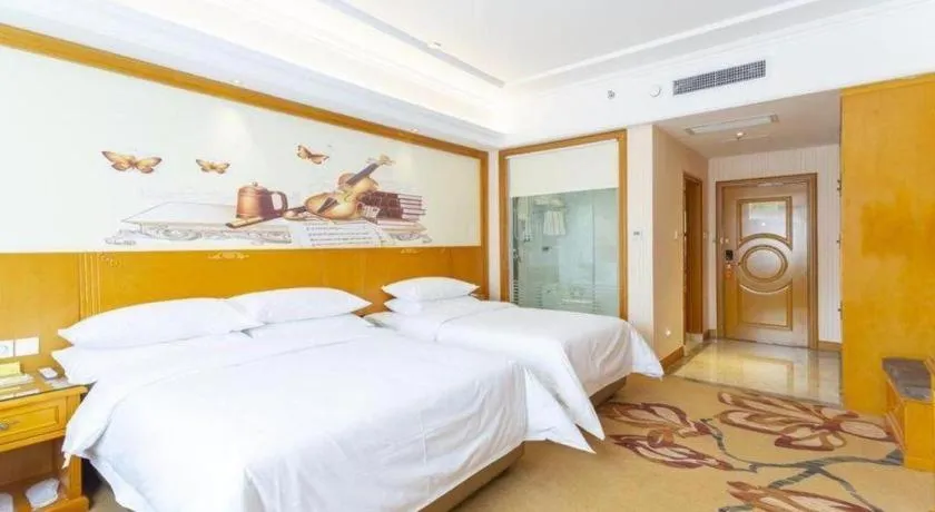 Bed in Vienna Hotel Shanxi Datong High-Speed Railway Station Wanda Plaza