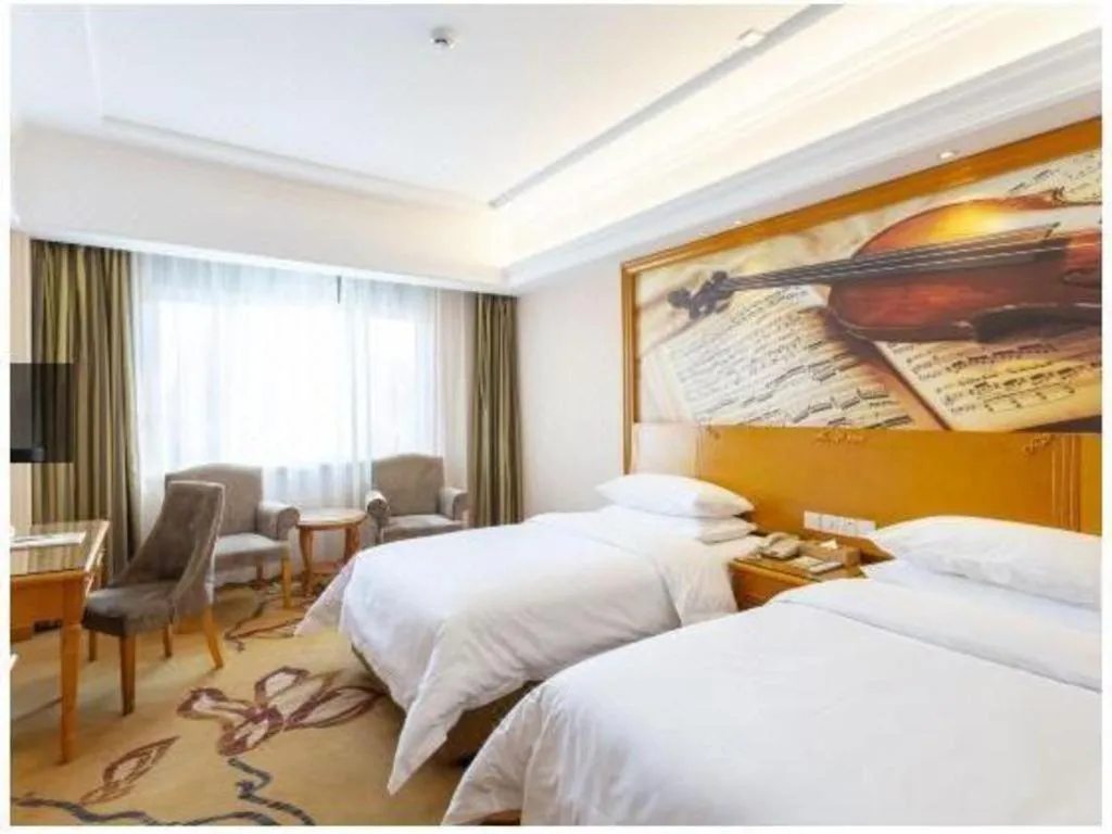 Bed in Vienna Hotel Shanxi Datong High-Speed Railway Station Wanda Plaza