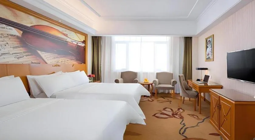Bed in Vienna Hotel Shanxi Datong High-Speed Railway Station Wanda Plaza
