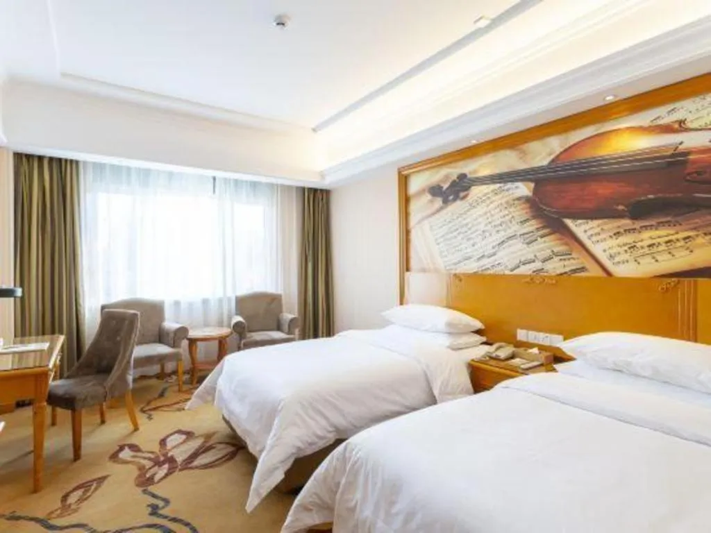 Bed in Vienna Hotel Shanxi Datong High-Speed Railway Station Wanda Plaza
