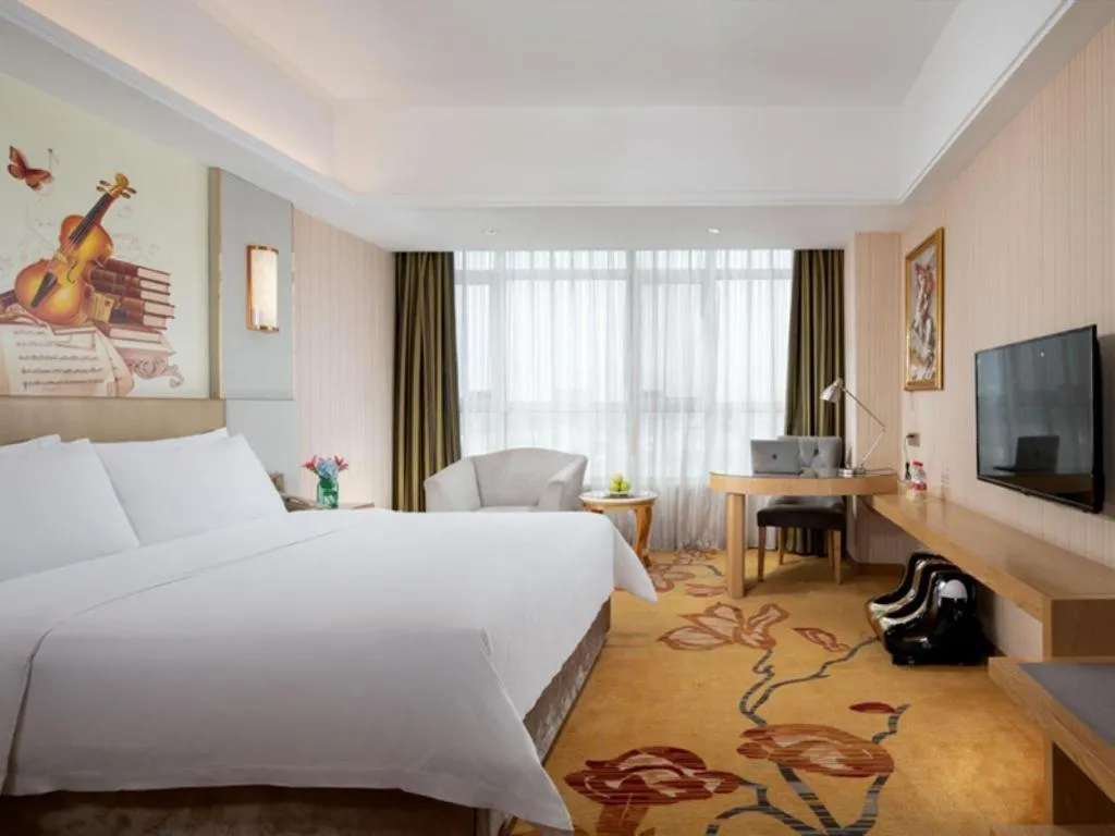 Bed in Vienna Hotel Shandong Qingzhou Ancient City