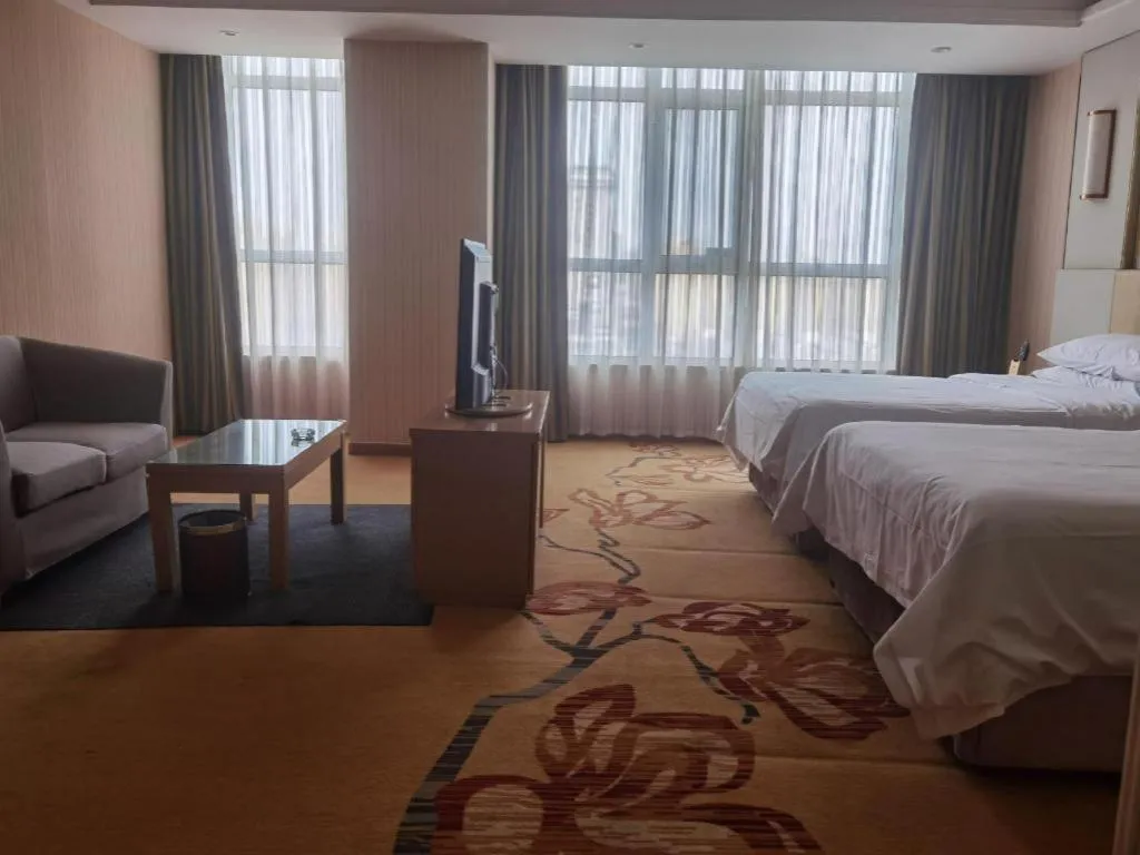 Bed in Vienna Hotel Shandong Qingzhou Ancient City