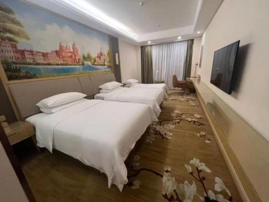 Bed in Vienna Hotel Tianjin Binhai International Airport Free Trade Zone