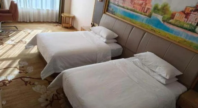 Bed in Vienna Hotel Tianjin Binhai International Airport Free Trade Zone