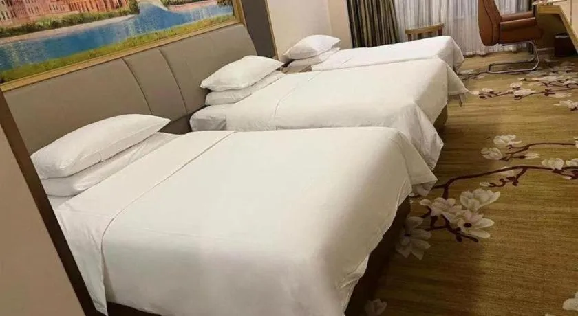 Bed in Vienna Hotel Tianjin Binhai International Airport Free Trade Zone