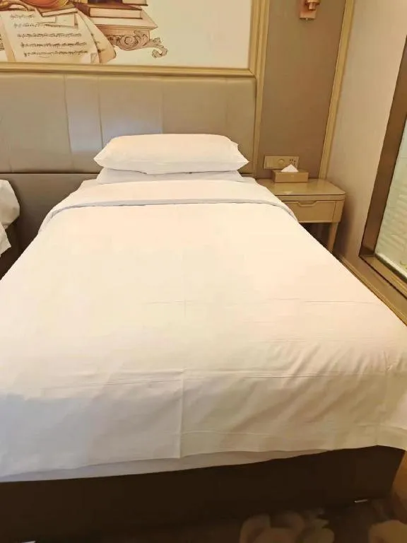 Bed in Vienna Hotel Shandong Qingdao Jiaodong International Airport Hai'er Avenue