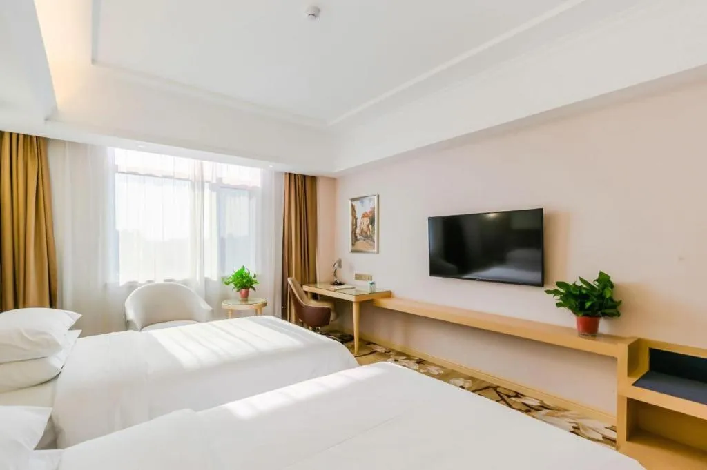 Bed in Vienna Hotel Shandong Qingdao Jiaodong International Airport Hai'er Avenue