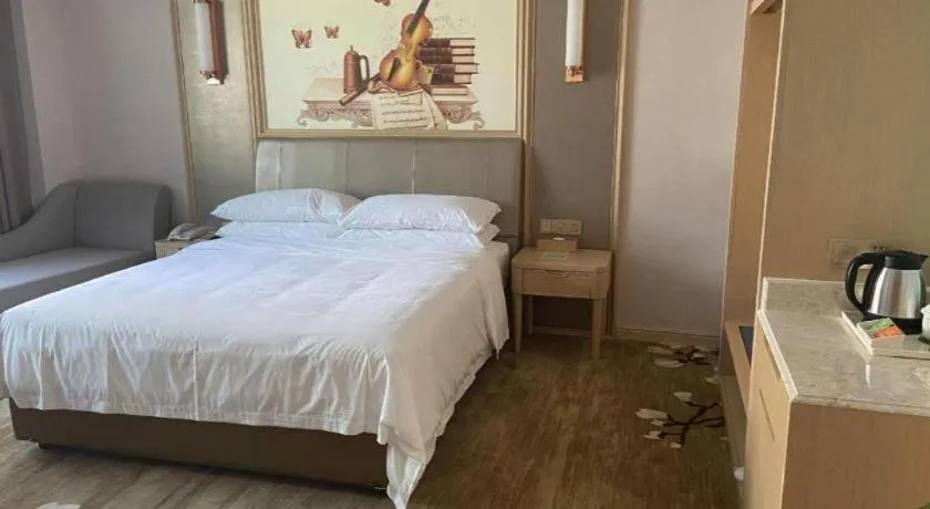 Bed in Vienna Hotel Shandong Qingdao Jiaodong International Airport Hai'er Avenue