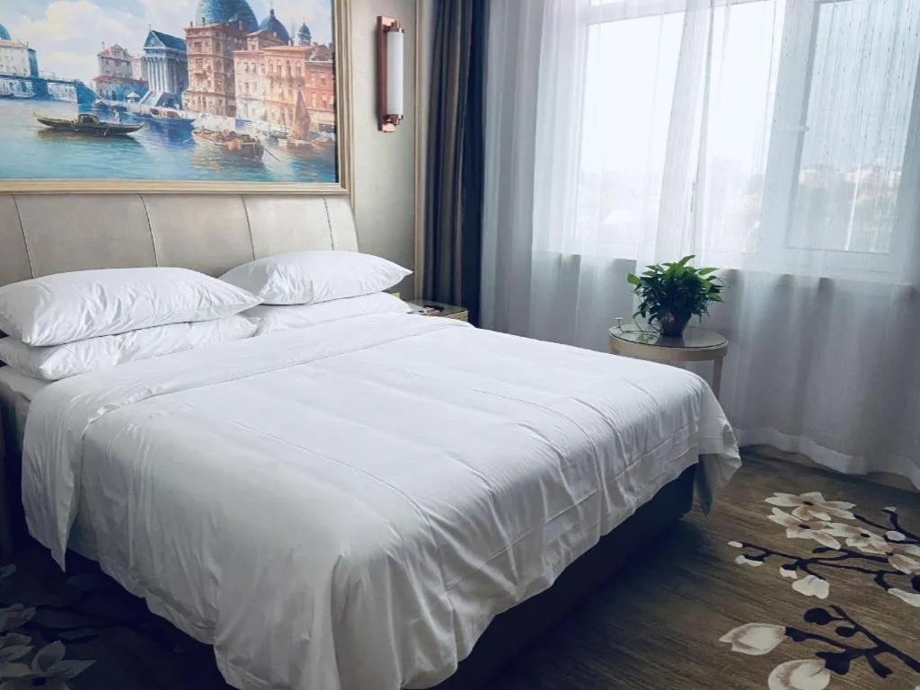 Bed in Vienna Hotel Shandong Qingdao Jiaodong International Airport Hai'er Avenue