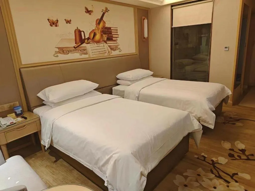 Bed in Vienna Hotel Shandong Qingdao Jiaodong International Airport Hai'er Avenue