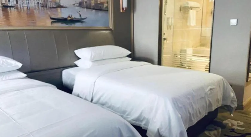 Bed in Vienna Hotel Shandong Qingdao Jiaodong International Airport Hai'er Avenue