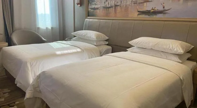 Bed in Vienna Hotel Shandong Qingdao Jiaodong International Airport Hai'er Avenue