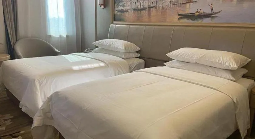 Bed in Vienna Hotel Shandong Qingdao Jiaodong International Airport Hai'er Avenue