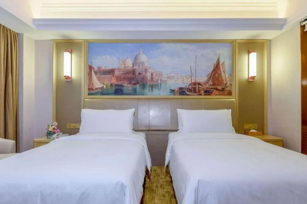 Bed in Vienna Hotel Shandong Qingdao Jiaodong International Airport Hai'er Avenue