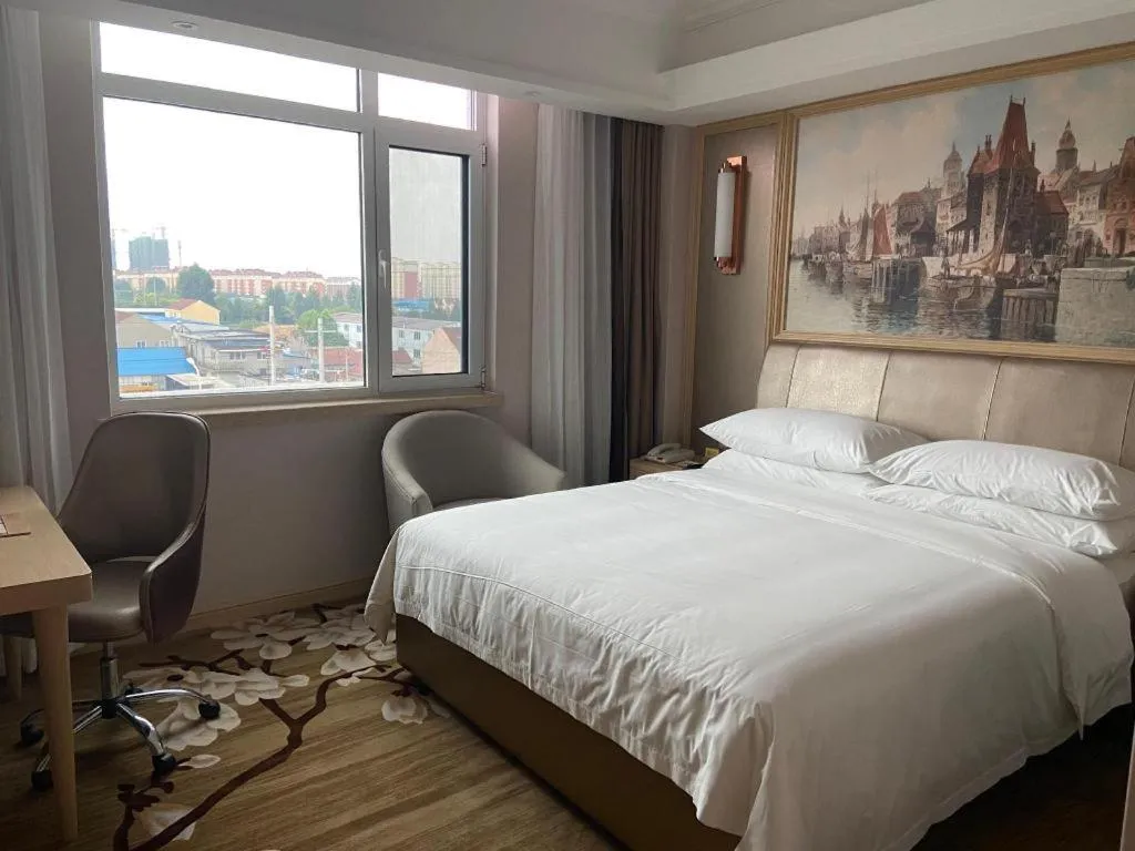 Bed in Vienna Hotel Shandong Qingdao Jiaodong International Airport Hai'er Avenue