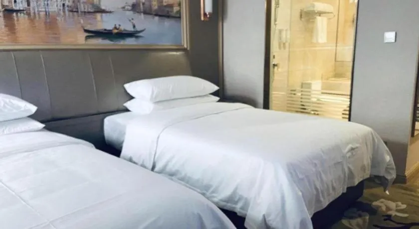 Bed in Vienna Hotel Shandong Qingdao Jiaodong International Airport Hai'er Avenue