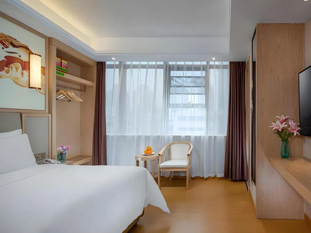 Bed in Vienna Hotel Zhengzhou Fengchan Road Fortune Plaza