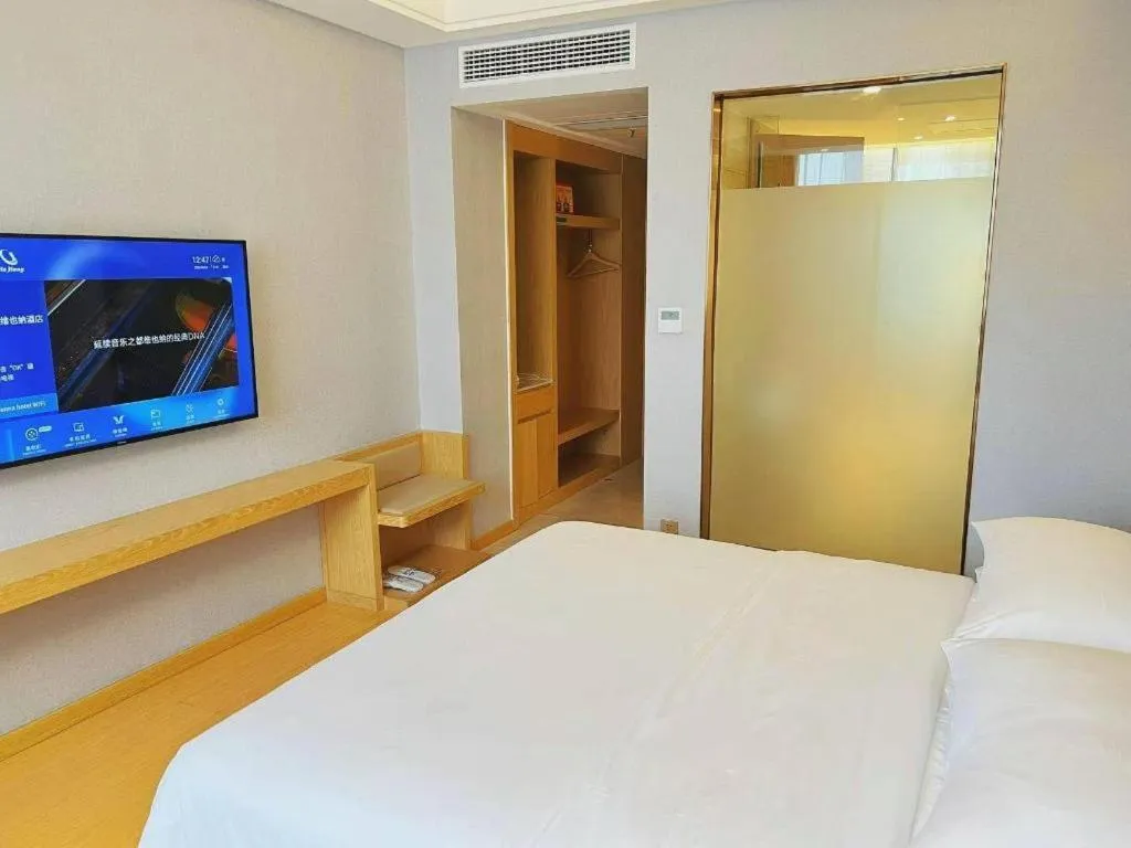 Bed in Vienna Hotel Zhengzhou Fengchan Road Fortune Plaza