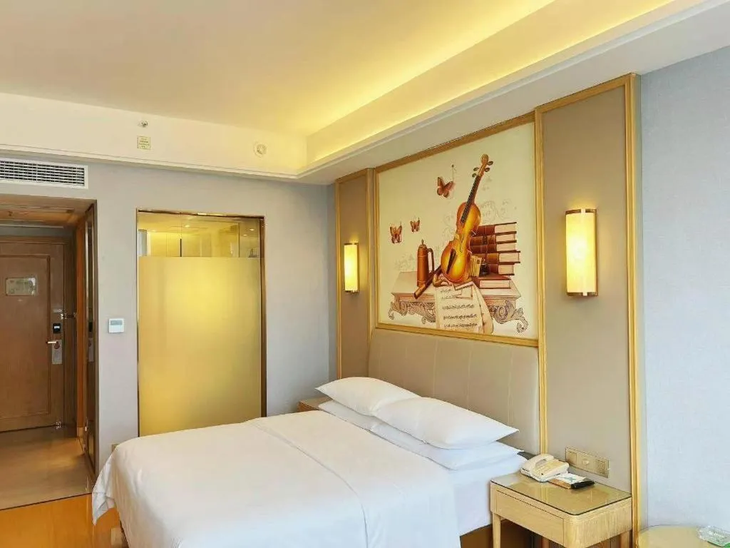 Bed in Vienna Hotel Zhengzhou Fengchan Road Fortune Plaza