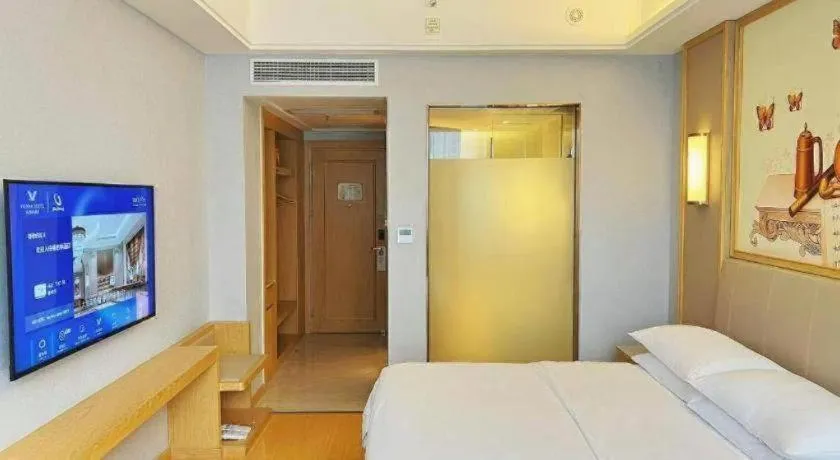 Bed in Vienna Hotel Zhengzhou Fengchan Road Fortune Plaza