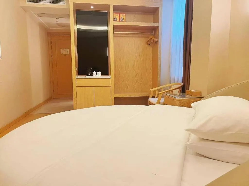 Bed in Vienna Hotel Zhengzhou Fengchan Road Fortune Plaza