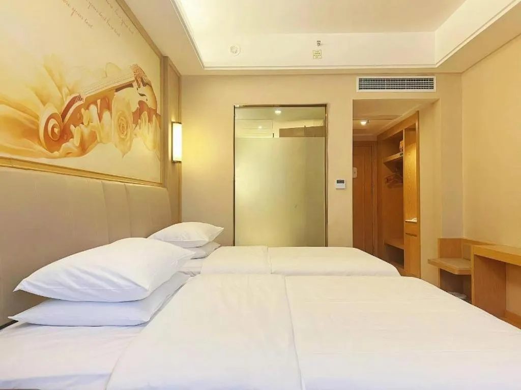 Bed in Vienna Hotel Zhengzhou Fengchan Road Fortune Plaza