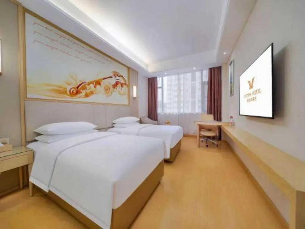 Bed in Vienna Hotel Zhengzhou Fengchan Road Fortune Plaza