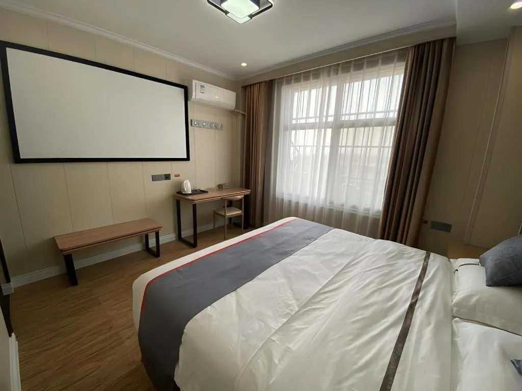 Bed in Jun Light Hotel Jiangxi Jiujiang Yongxiu County Dongyong Mall