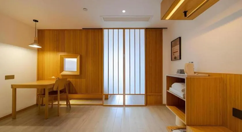 Bed in Meijin All Suites Hotel Suzhou