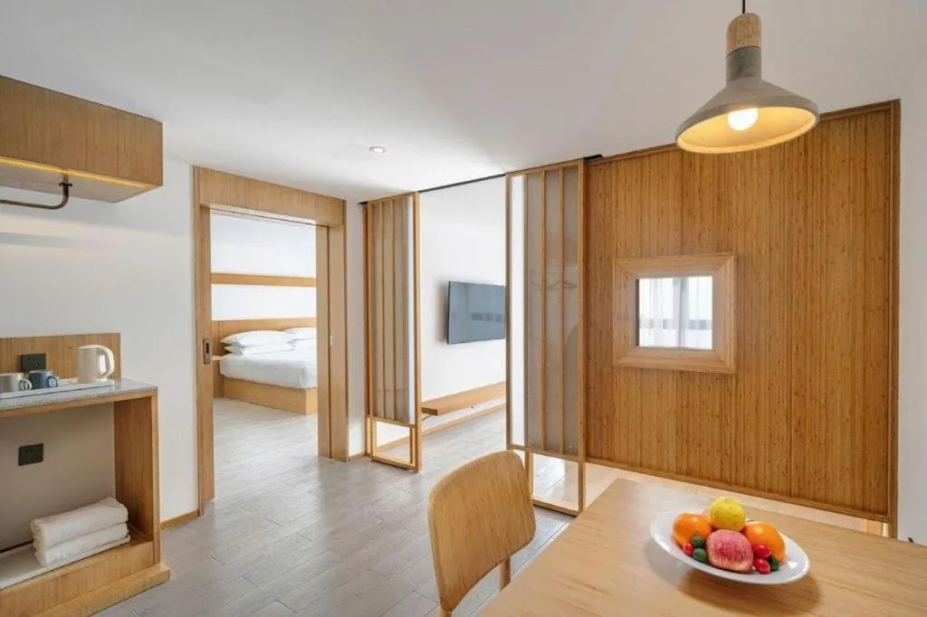 Bed in Meijin All Suites Hotel Suzhou