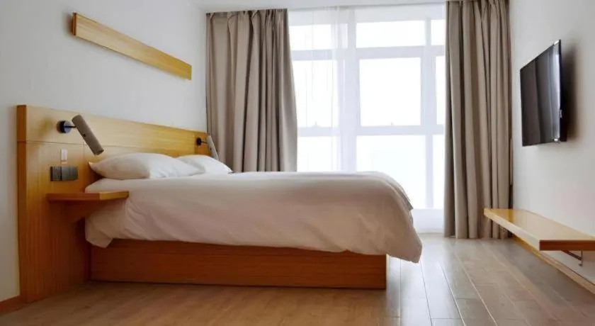 Bed in Meijin All Suites Hotel Suzhou