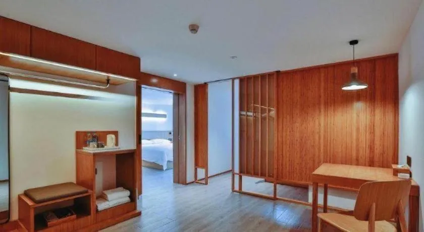 Bed in Meijin All Suites Hotel Suzhou